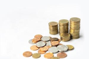 coins and stacks of coins on a white background photo