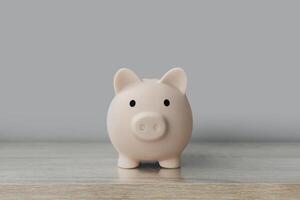 a piggy bank sitting on a wooden table photo