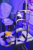 A modern microscope for vision testing in a light room. Microscope for vision correction. photo