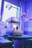A modern microscope for vision testing in a light room. Microscope for vision correction. photo
