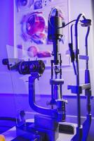 A modern microscope for vision testing in a light room. Microscope for vision correction. photo