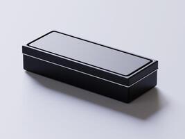 A black box sitting on a white surface photo