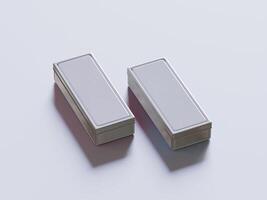 Two silver boxes sitting on a white surface photo