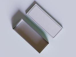 Two empty boxes on a white surface photo