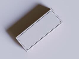 A white box with a blank surface on a gray background photo