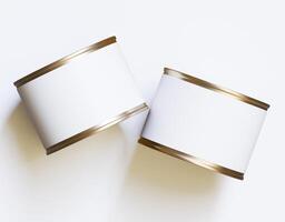 Two empty cans on a white surface photo