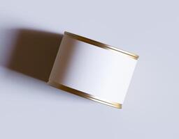 A white can with a gold trim on a white background photo
