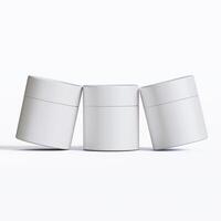Three white containers with lids on a white surface photo