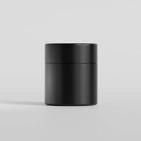 A black container with a lid on a white surface photo
