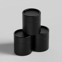 Three black containers with lids on a white surface photo