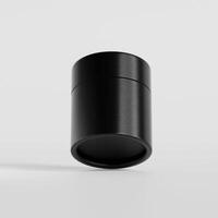 A black container with a lid on a white surface photo