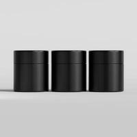Three black containers with lids on a white surface photo