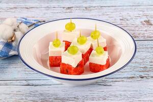 Watermelon with feta and grape photo