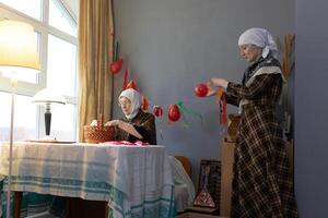 Two women sitting at a table photo