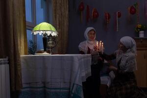 Two women sitting on a table photo
