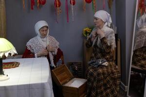Two women sitting at a table photo