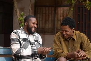 two handsome african feeling excited about what they saw on their cellphone photo