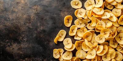 Collection of banana chips spread on a smooth surface, gastronomy photography photo
