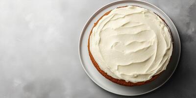 Carrot cake with smooth frosting layer on a flat serving dish, meal photography photo