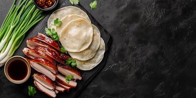 Peking duck with pancakes and scallions, food setting photo