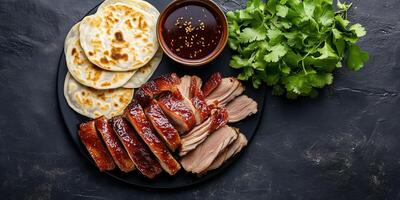 Peking duck with hoisin sauce and pancakes, food setting photo