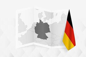 A grayscale map of Germany with a hanging German flag on one side. Map for many types of news. vector