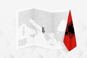 A grayscale map of Albania with a hanging Albanian flag on one side. Map for many types of news. vector