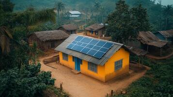 A small yellow house with solar panels on the roof photo