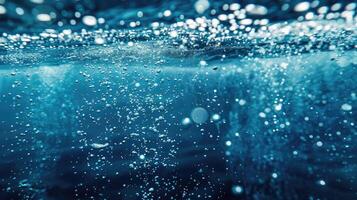 Water bubbles under the surface of the ocean photo