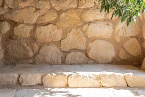Rustic stone wall with steps photo