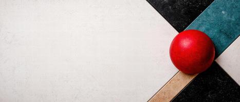 red apple on abstract geometric background photo