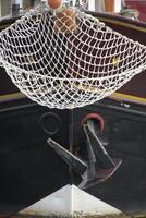A boat with a net attached to it photo
