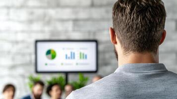 Businessman analyzing data on computer screen photo