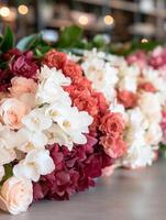 Vibrant floral arrangement with roses, orchids, and hydrangeas photo