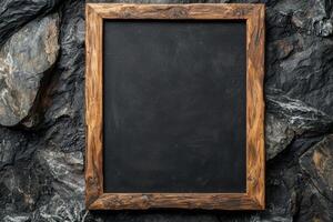 Rustic wooden frame on a dark slate background photo