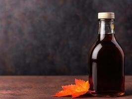 Autumn maple syrup bottle on rustic wooden table photo