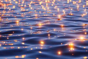 Floating red glowing plankton illuminate the deep ocean creating surreal reflections in tranquil waters photo