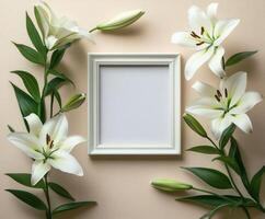White lilies surrounding empty frame on beige background photo
