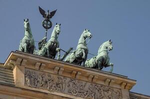 A building with statues on top of it photo