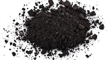 Black powder pile isolated on white background photo