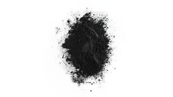 Black powder pile isolated on white background photo
