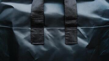 Close up of dark navy blue fabric tote bag handles. Concept of simple, durable, and practical. photo