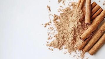 Cinnamon sticks and powder on white background. Spice concept. photo