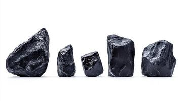 Black stones collection isolated on white background photo