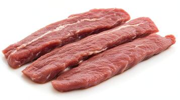 Three raw beef strips. Concept of meat, food, cooking, and protein. photo