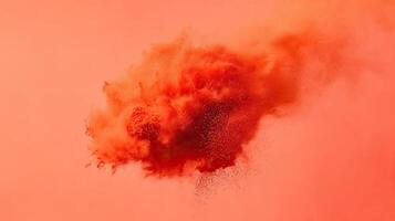 Orange powder explosion. Abstract background. photo