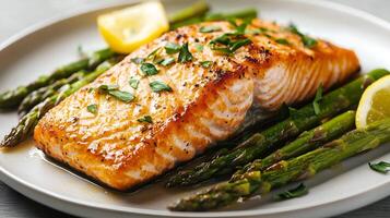 Salmon and asparagus on a plate photo