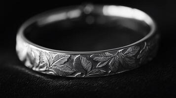 A silver ring with leaves on it photo