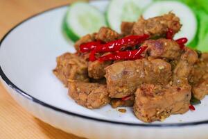 Indonesian Food - Tempeh Sweet Soy Sauce or Orek Tempe. Top View with Copy Space for Advertisement photo
