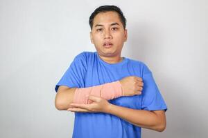 A man is in pain because of a broken forearm bone photo